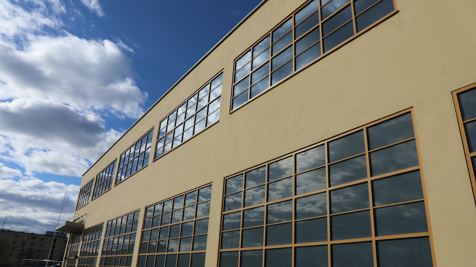 A large factory building with rows of windows